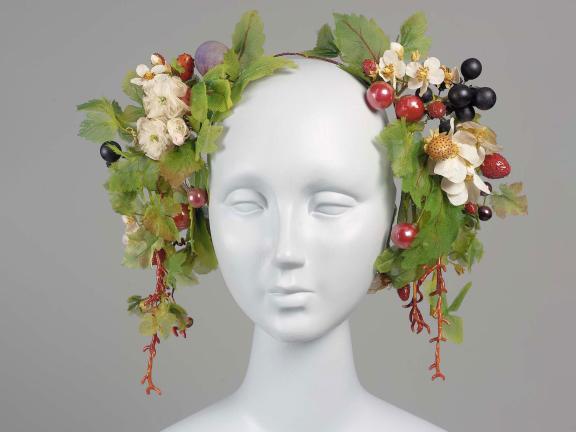 headdress with leaves and grapes on a mannequin